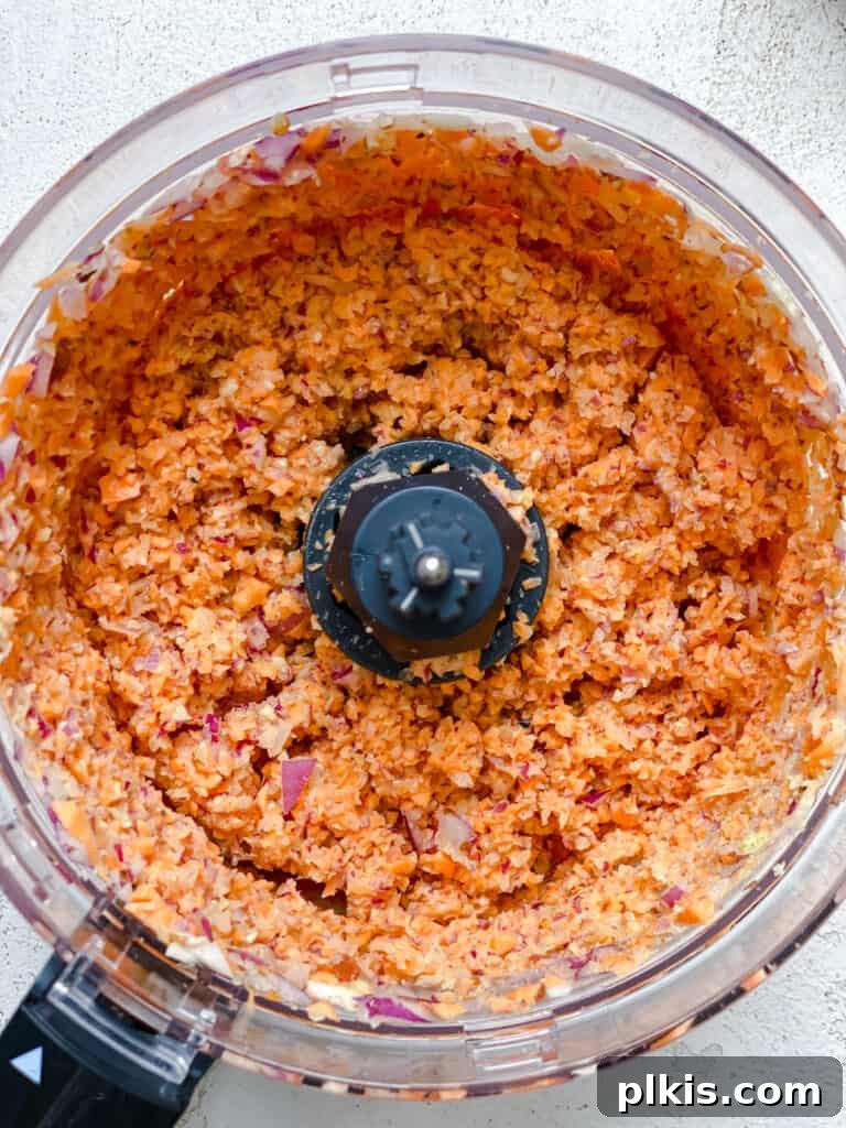 Ultimate Vegan Lentil Burgers 7 Post-processing of initial ingredients in a food processor, creating a uniform mixture.