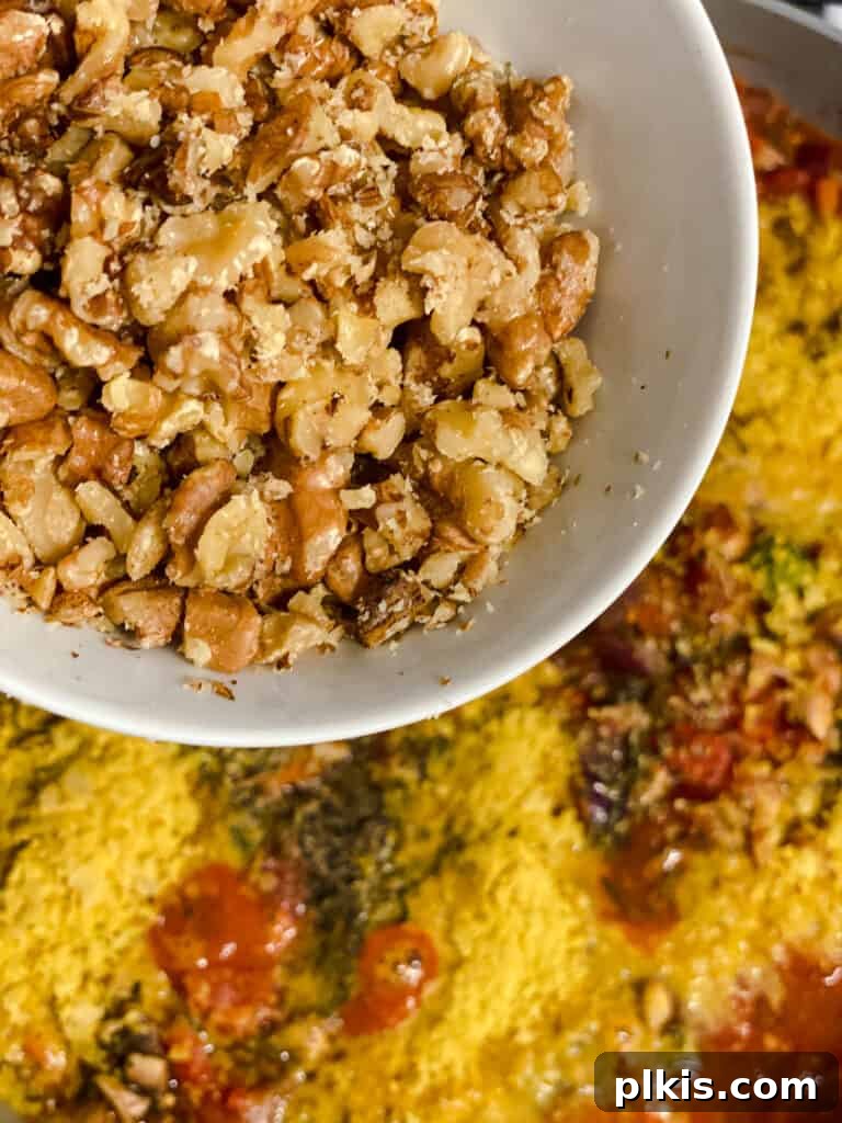 process shot of adding walnuts to pan