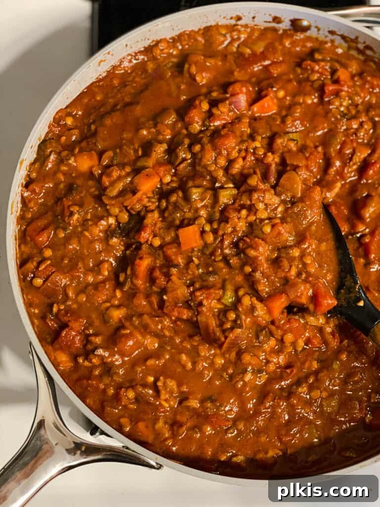 process shot of mixing ingredients together in pan