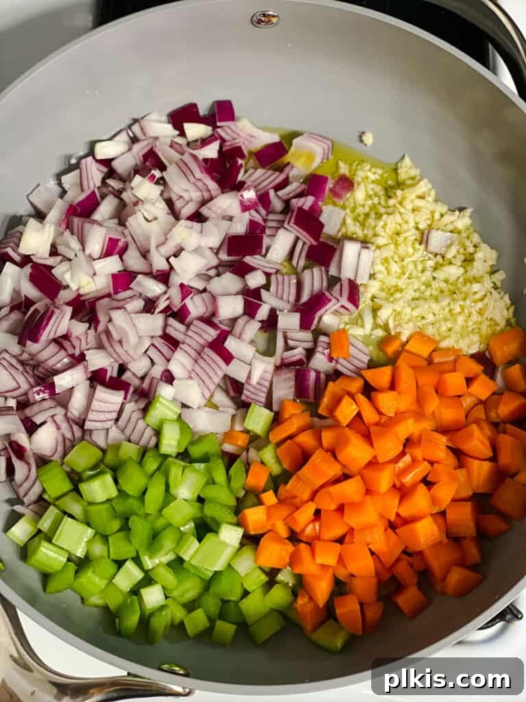 process shot of veggies added to pan