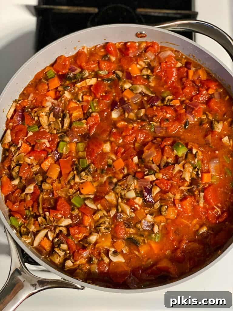 process shot of mixing ingredients together in a pan
