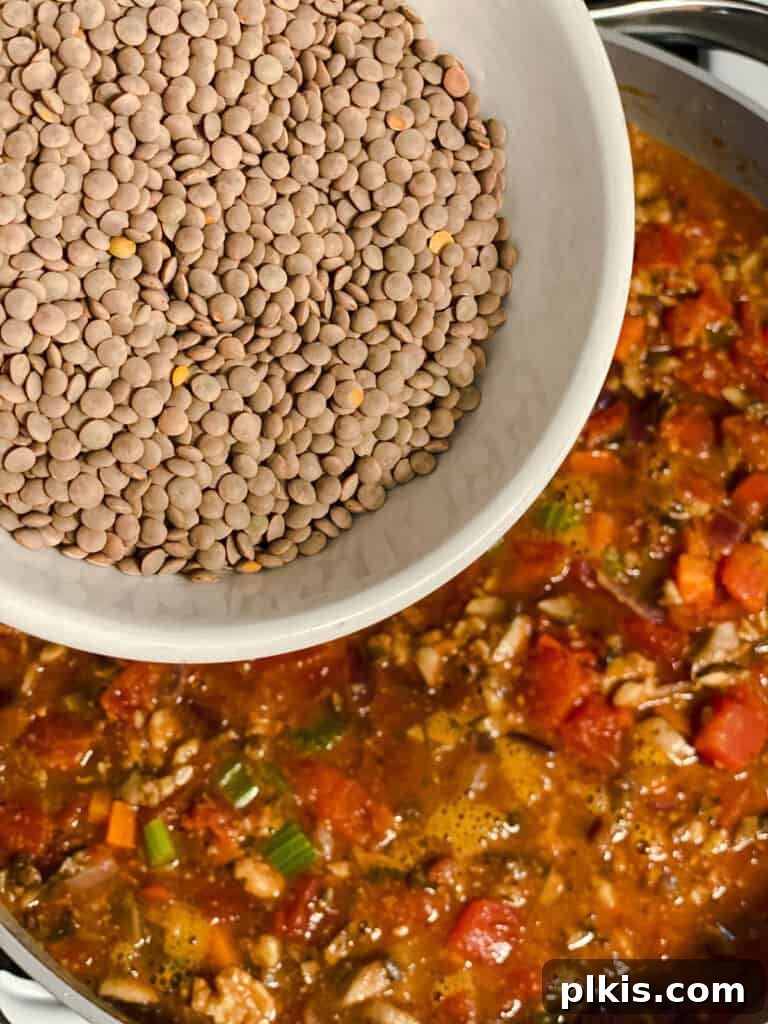 process shot of adding lentils to pan