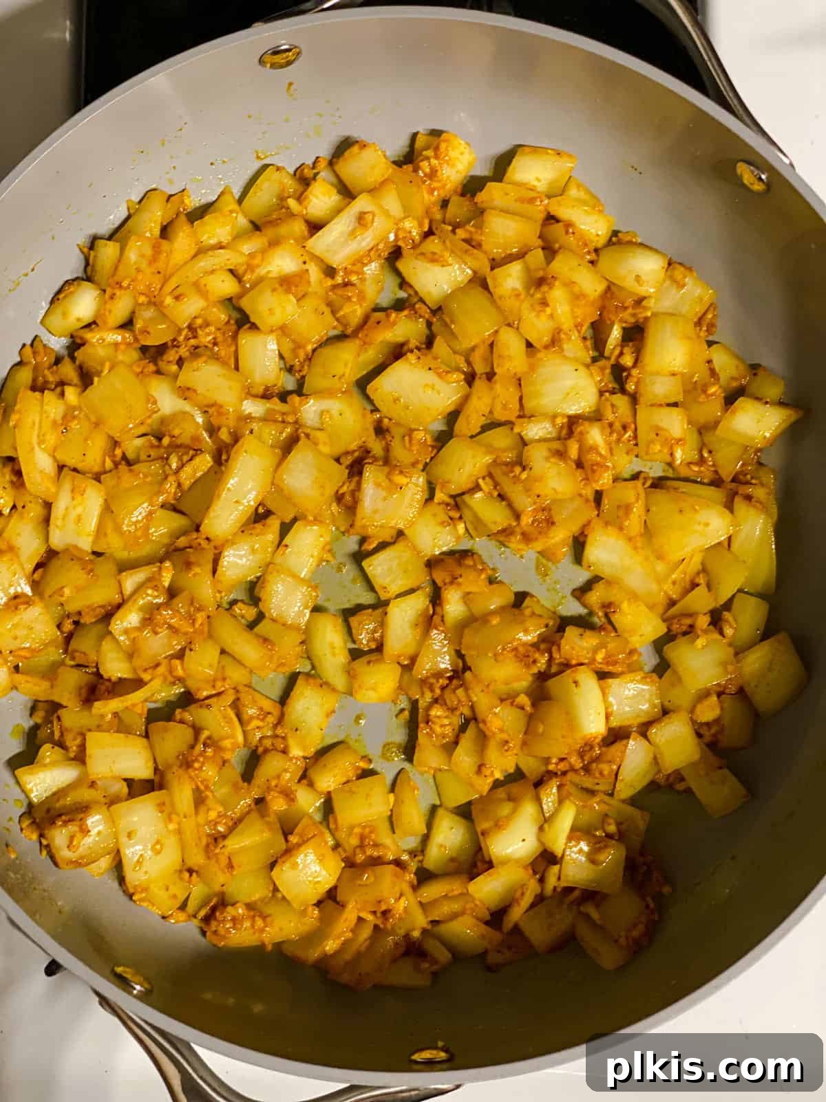 process shot of mixing ingredients together in pan
