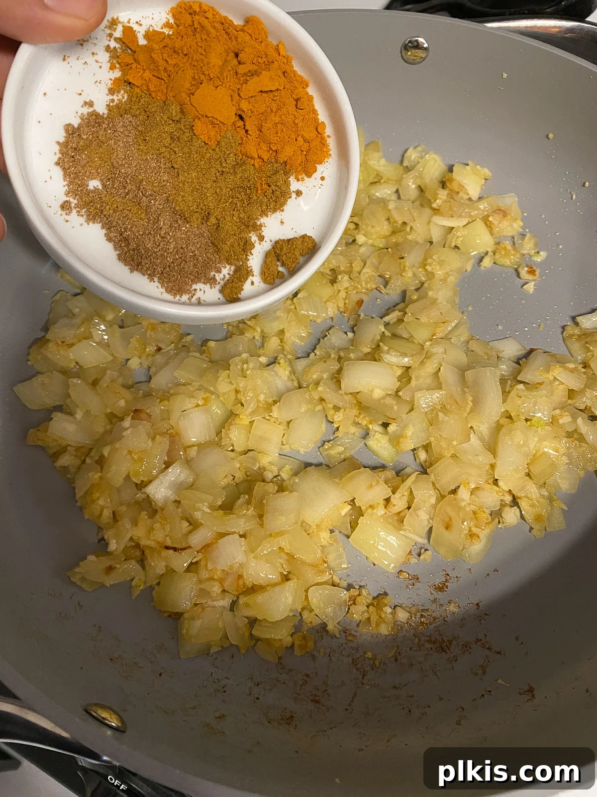 Sunshine in a Bowl: Easy Yellow Dal 7 process shot of spices added to pan