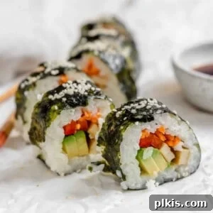 completed Vegan Sushi Rolls with Crispy Tofu spread out along a white surface