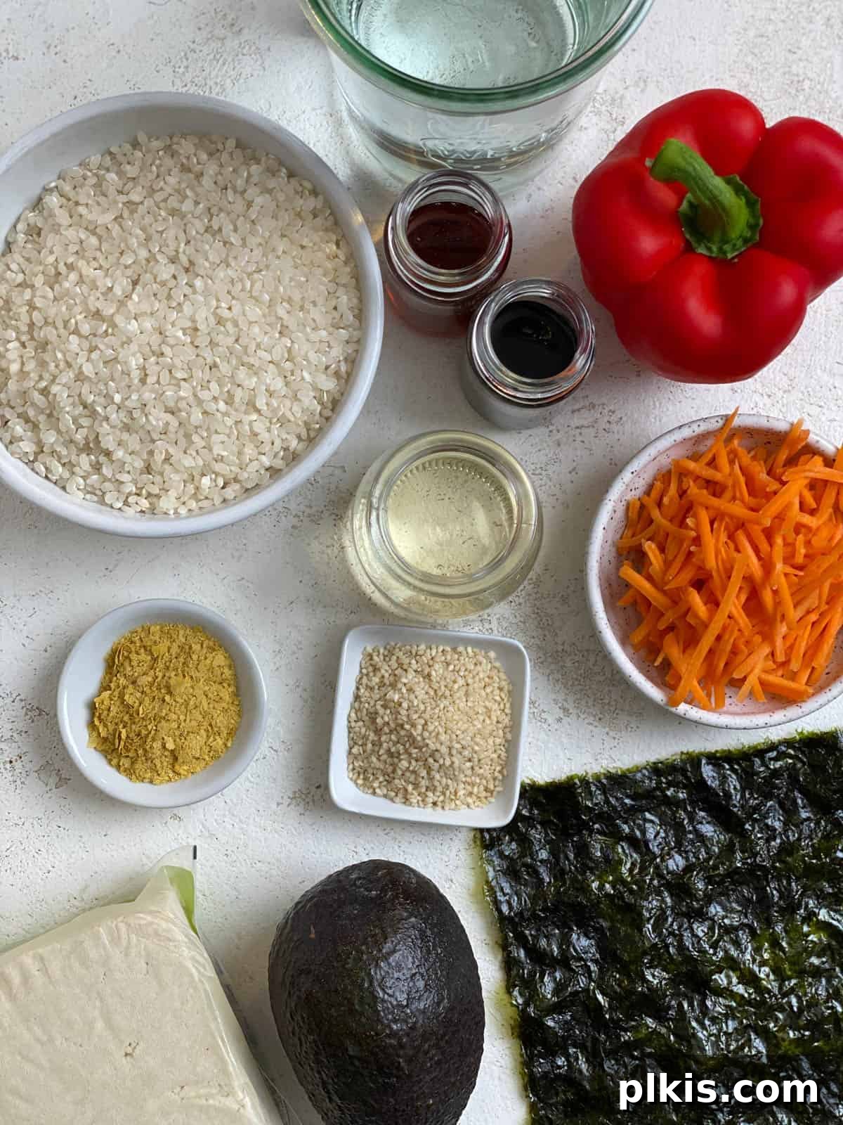 Plant-Powered Sushi Rolls 3 ingredients for Vegan Sushi Rolls with Crispy Tofu measured out against a light surface