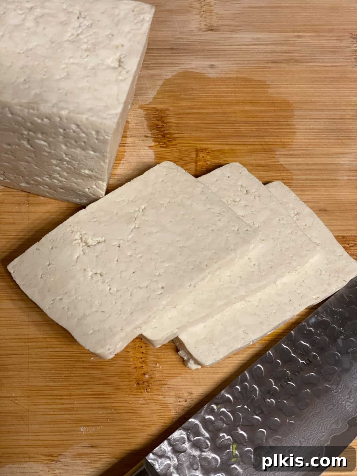 Plant-Powered Sushi Rolls 4 slices of tofu on a cutting board