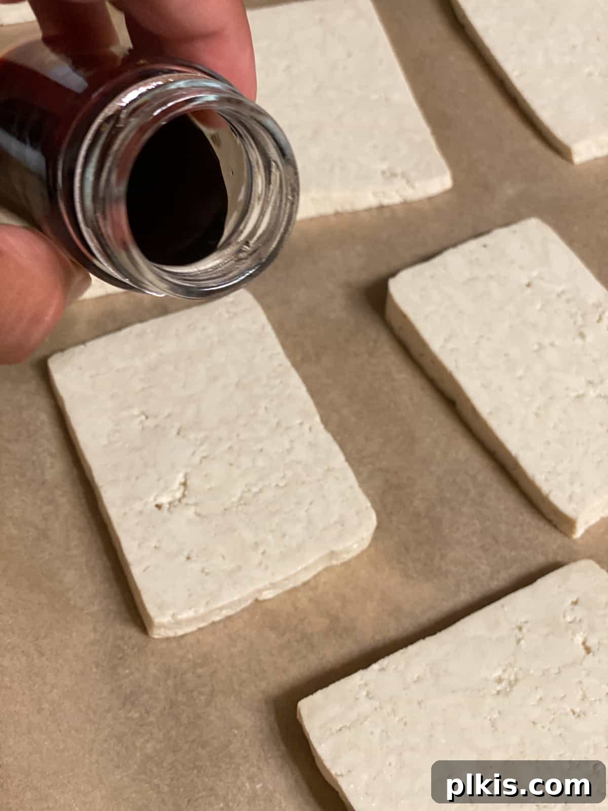 Plant-Powered Sushi Rolls 6 process shot of adding soy sauce to tofu