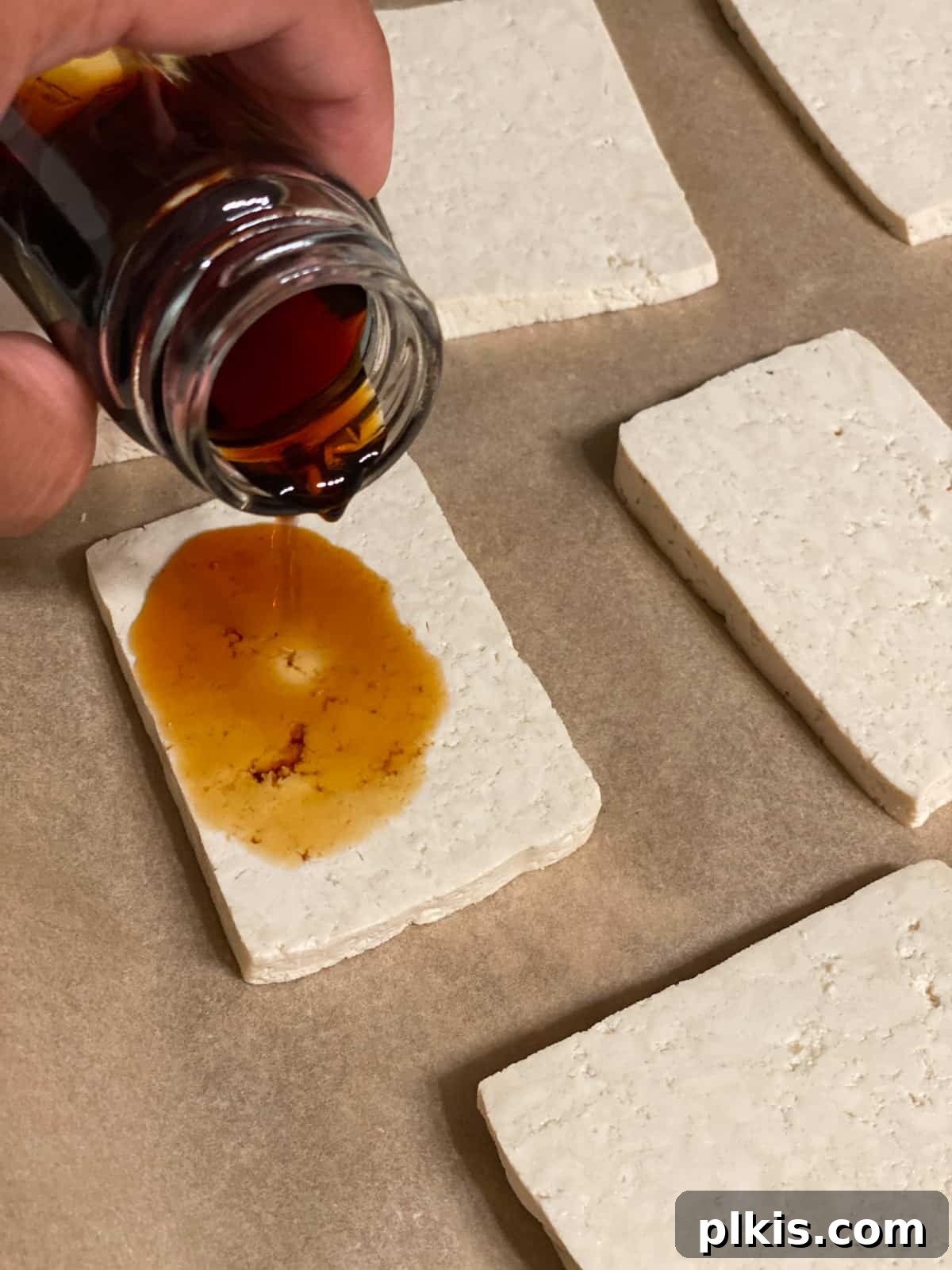 Plant-Powered Sushi Rolls 7 process shot of adding soy sauce to tofu