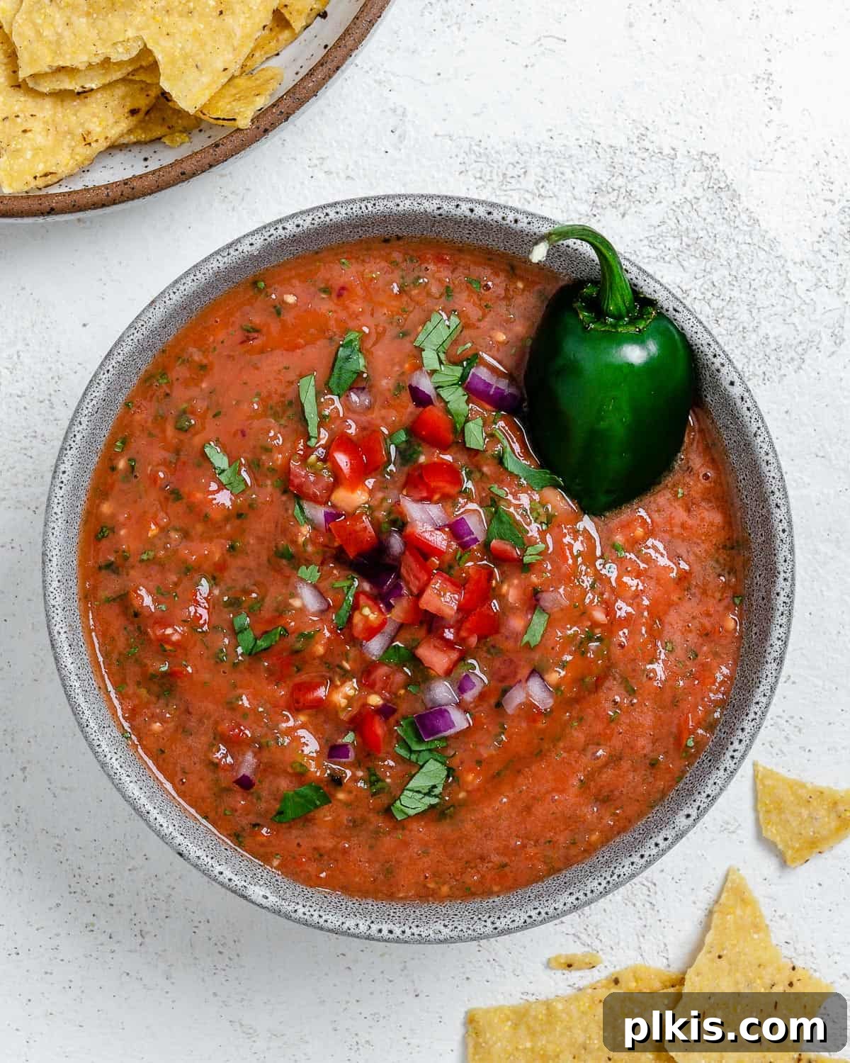 Blender Magic: 5-Minute Restaurant Salsa 2 A bowl of vibrant, fresh blender salsa ready to be served with tortilla chips.
