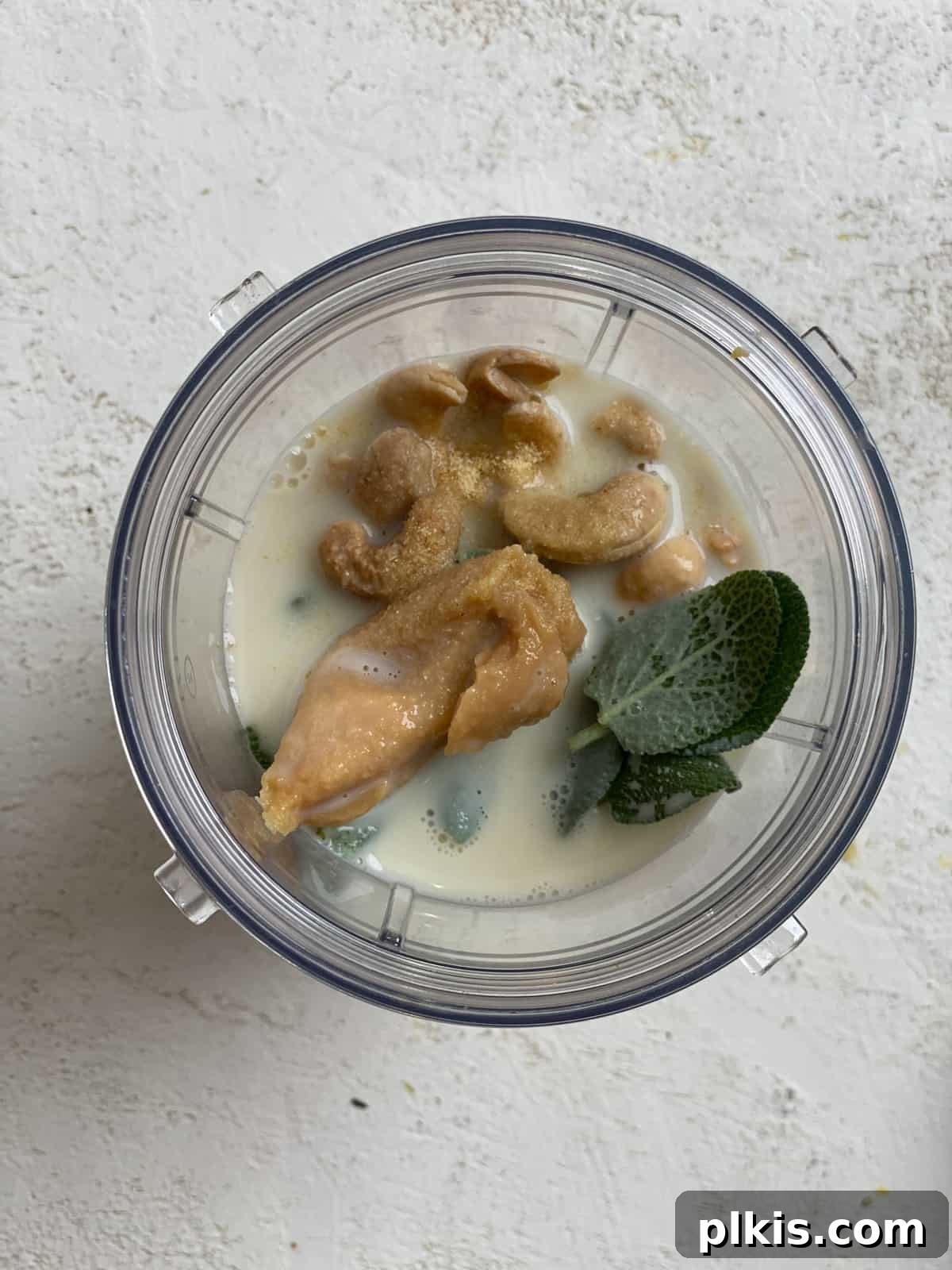 Autumn Pumpkin Pasta Shells with Aromatic Sage Cream 15 Ingredients for sage cashew cream being added to a blender