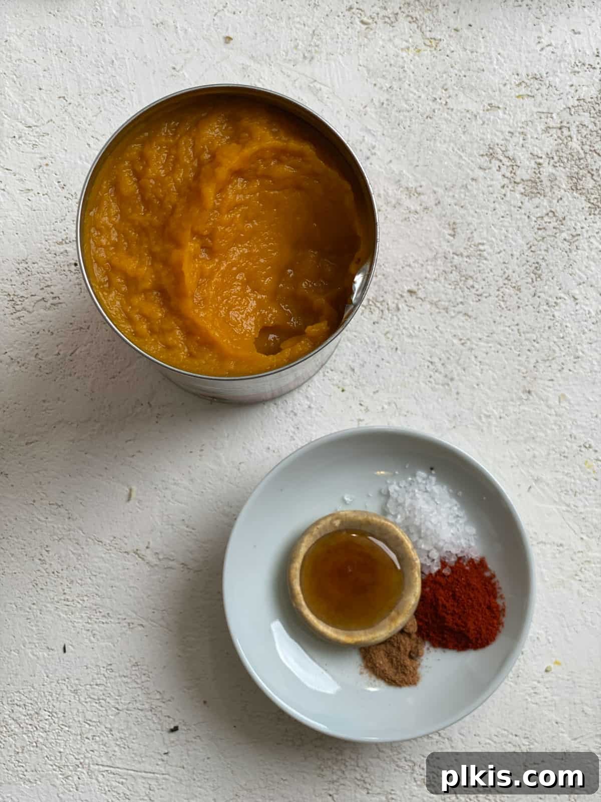 Autumn Pumpkin Pasta Shells with Aromatic Sage Cream 9 Can of pumpkin puree next to a small plate of spices for the pumpkin filling