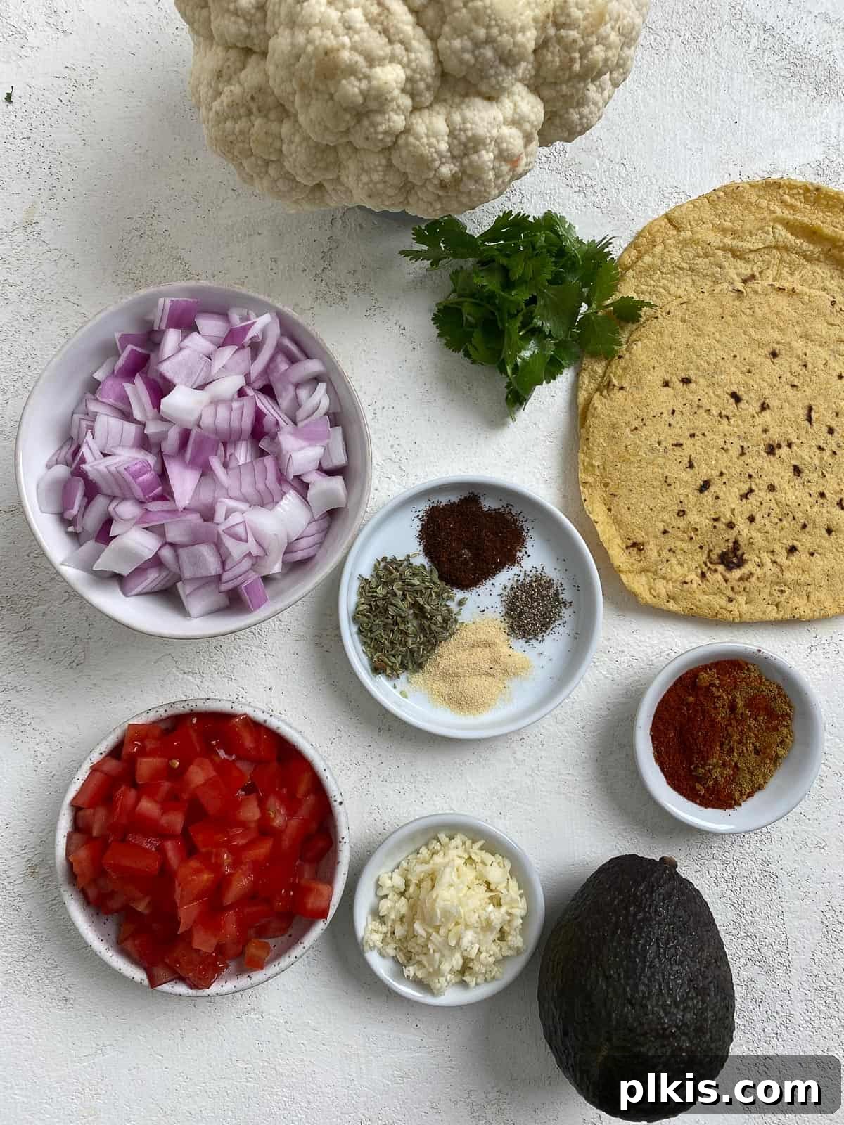 Roasted Cauliflower Tacos 3 Carefully measured ingredients for Cauliflower and Lentil Tacos laid out on a light surface, ready for preparation.