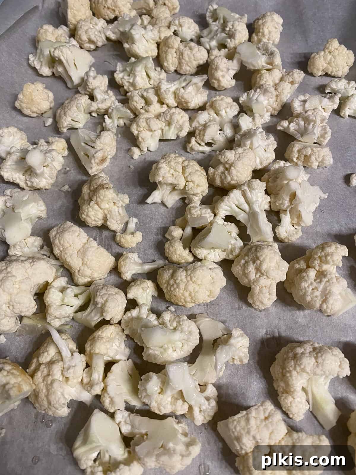 Roasted Cauliflower Tacos 4 Uniform cauliflower florets arranged on a baking sheet, ready for roasting to achieve perfect tenderness and flavor.