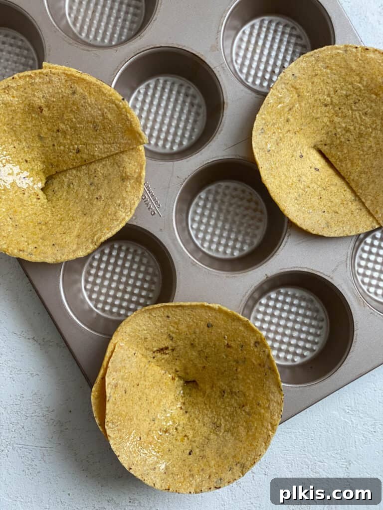 Zesty Black Bean Crunch Cups 4 process of adding tortillas to muffin tin