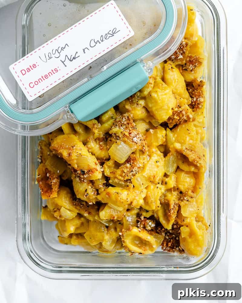 Ultimate Vegan Mac Bake 11 Vegan Baked Mac and Cheese stored in a clear container in the refrigerator.