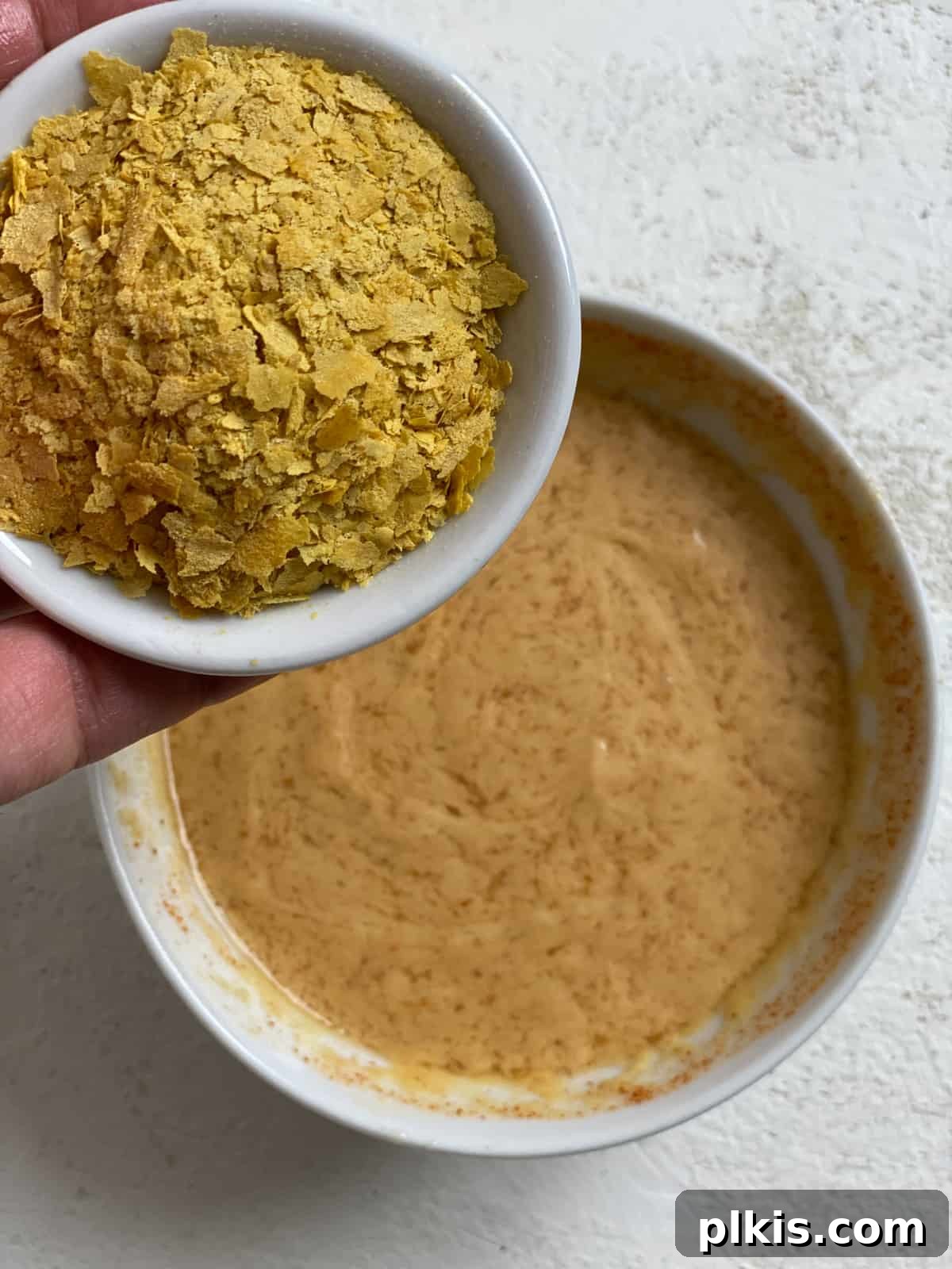Effortless Vegan Brussels Sprouts Delight 6 Adding nutritional yeast to the tahini sauce mixture for a cheesy flavor