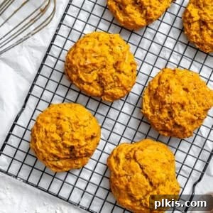 Velvet Sweet Potato Biscuits 10 baked sweet potato biscuits on a wire rack.