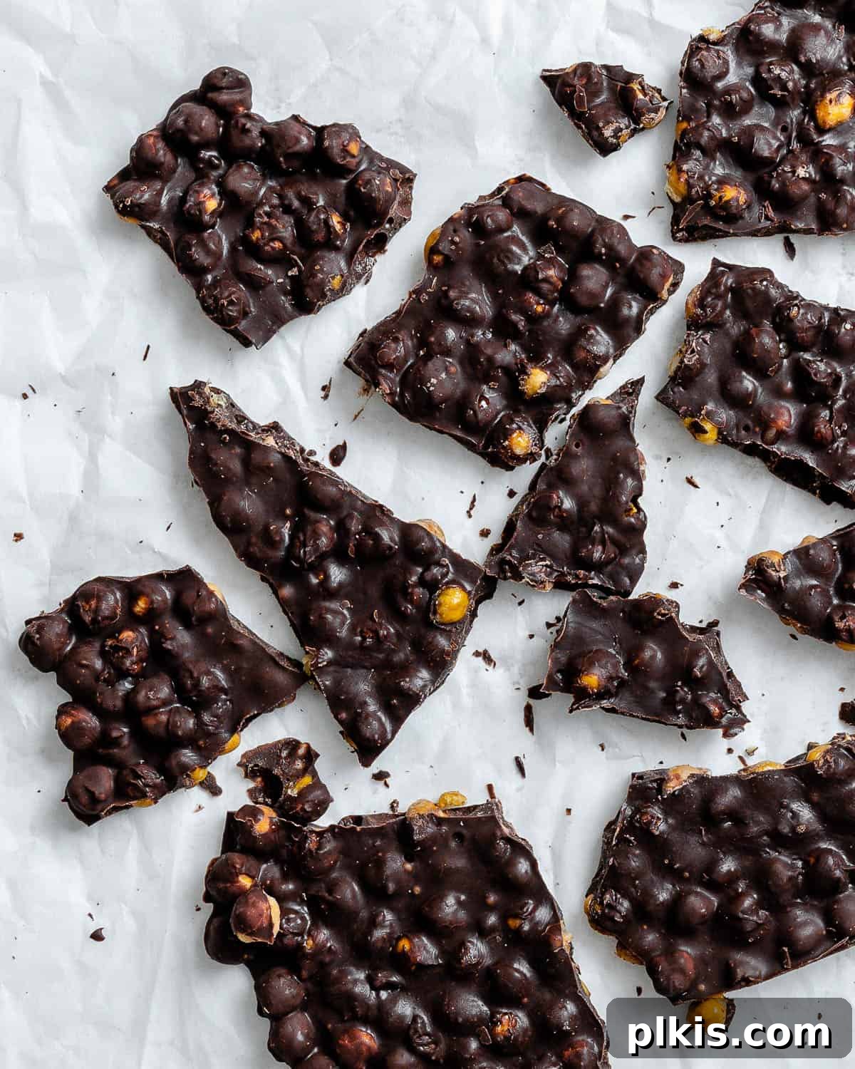 Irresistible Chocolate Chickpea Bites 8 Close-up of freshly made chocolate covered chickpeas bark, showcasing its texture and the sprinkle of flaky salt.