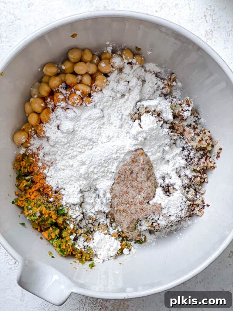 Golden Quinoa Chickpea Fritters 7 ingredients for Quinoa Chickpea Patties added to a white bowl