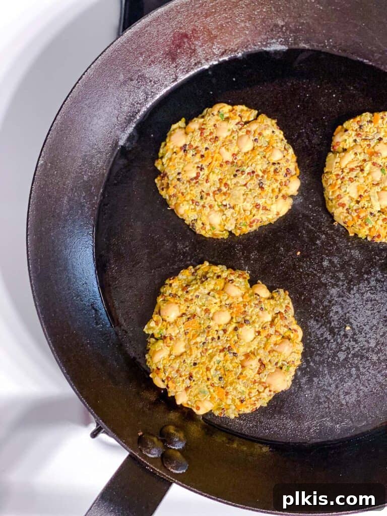 Golden Quinoa Chickpea Fritters 9 process shot of cooking patties on a skillet