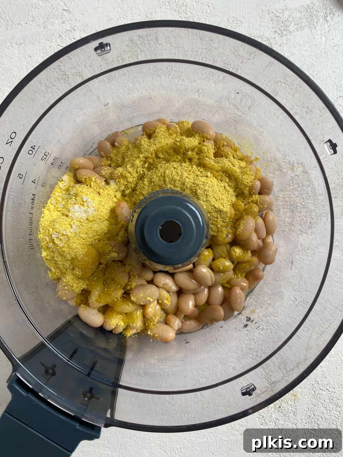 Velvety Brown Rice Risotto 6 Ingredients for Creamy Brown Rice Risotto being added to a food processor.