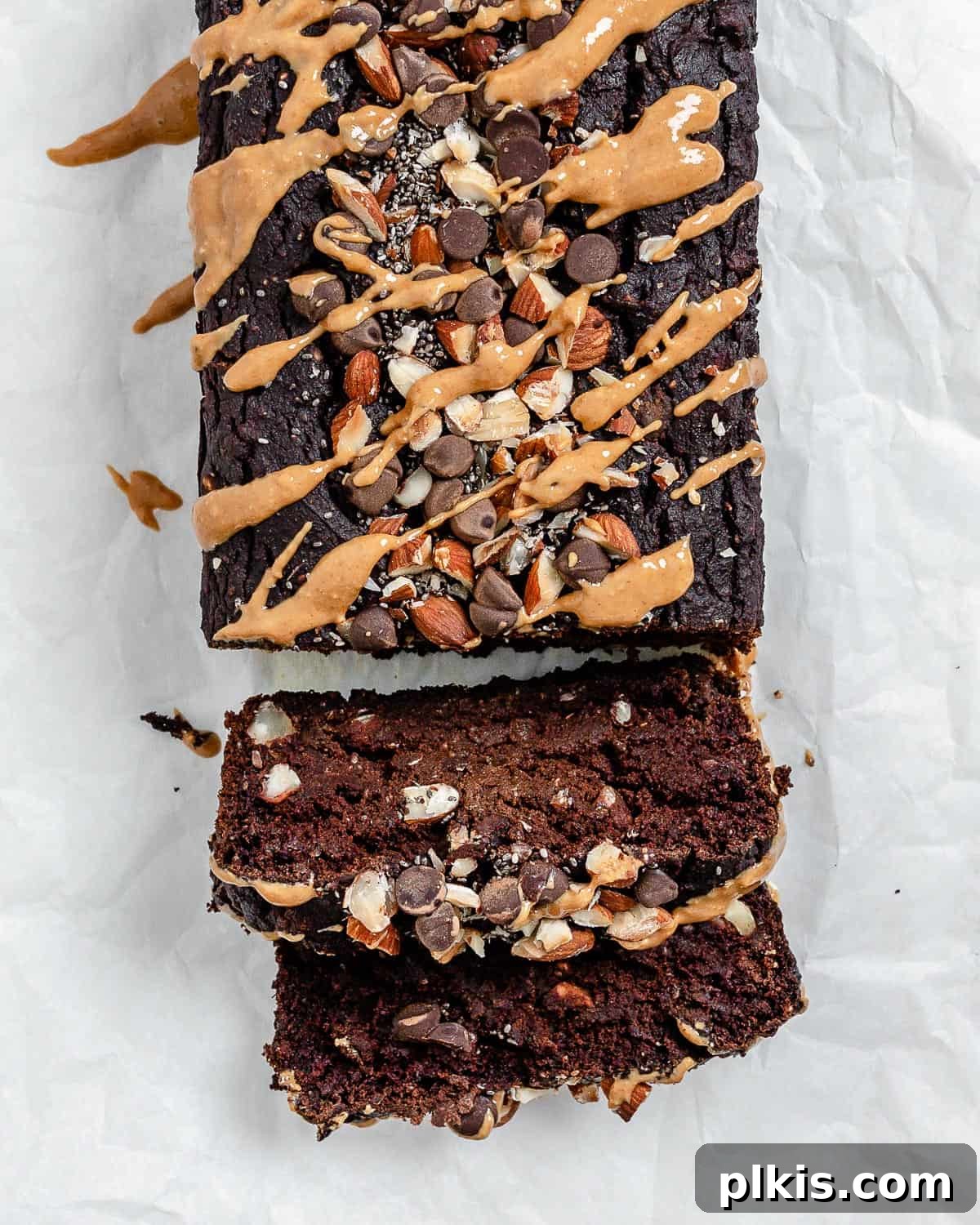 Decadent Sweet Potato Chocolate Cake 14 Two perfectly sliced pieces of Sweet Potato Chocolate Cake displayed on a white surface, highlighting the rich, moist texture