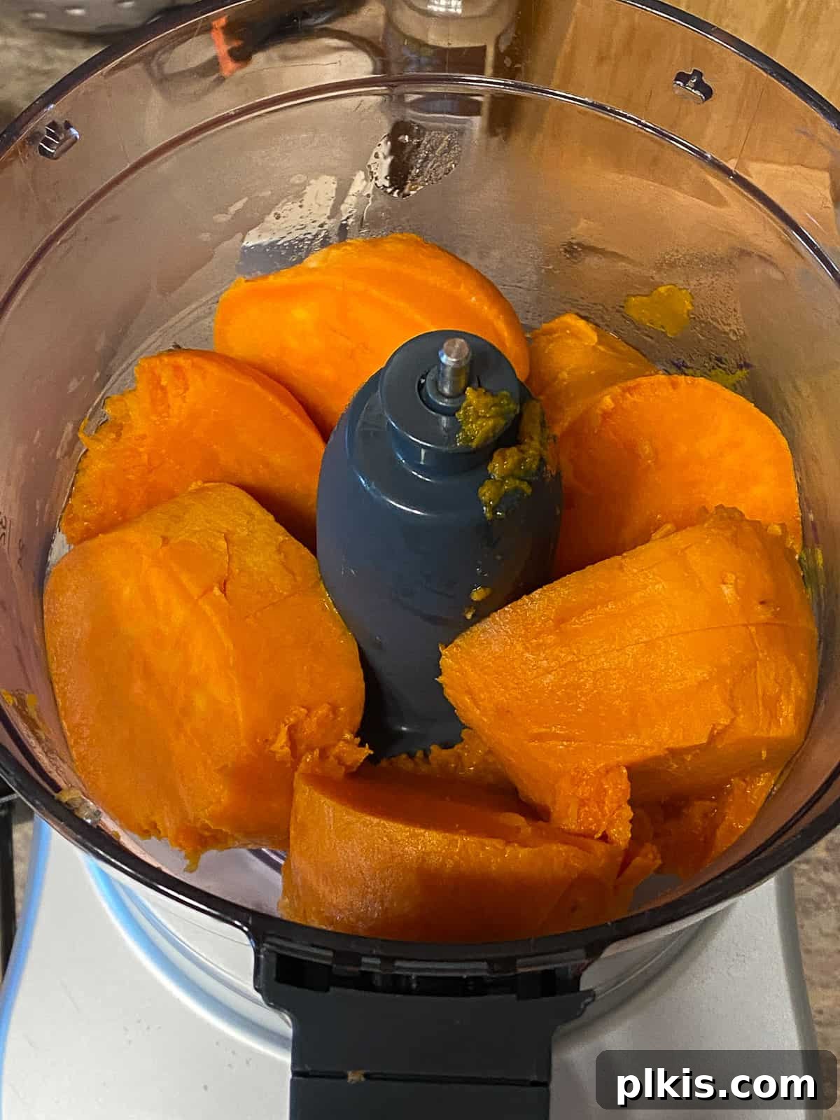 Decadent Sweet Potato Chocolate Cake 4 Diced sweet potatoes being pureed into a smooth consistency in a food processor