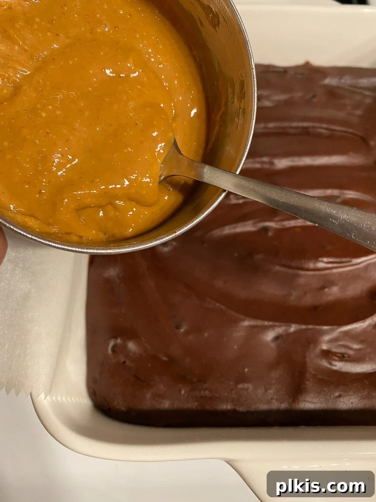 Decadent Vegan Sweet Potato Brownies 12 process of adding peanut butter mixture to top of brownie mixture