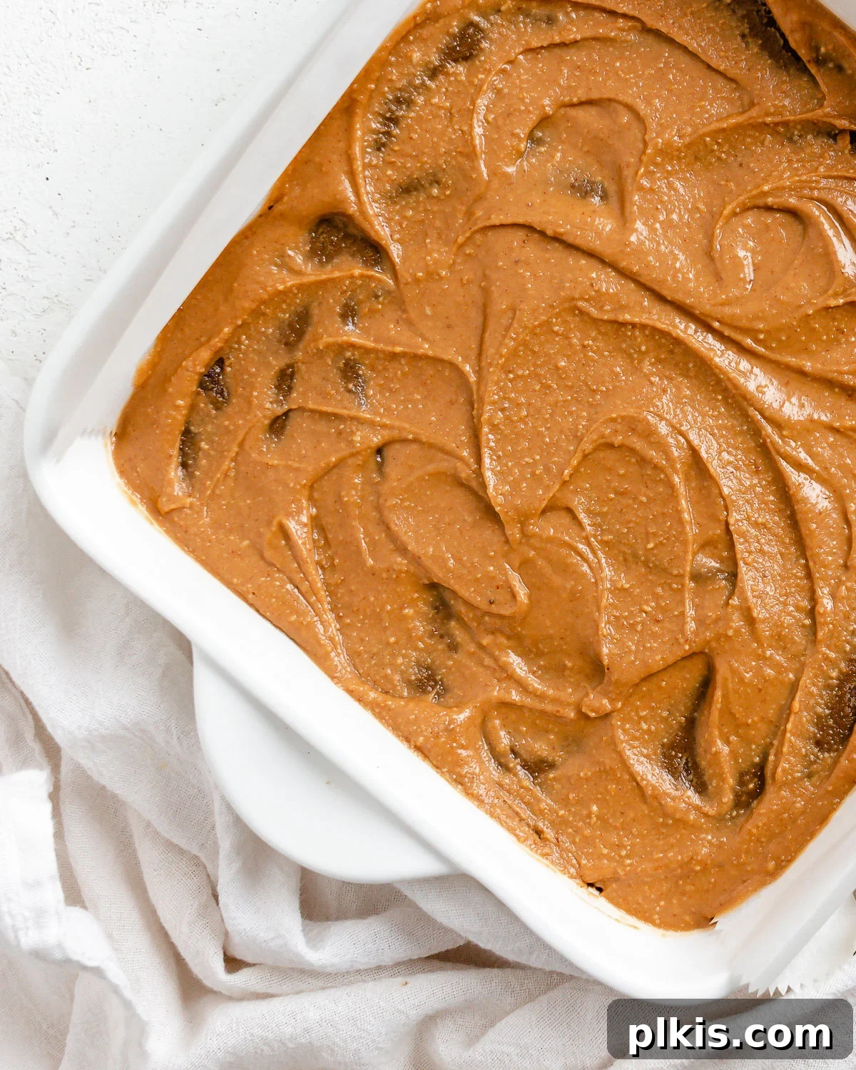 Decadent Vegan Sweet Potato Brownies 14 completed Sweet Potato Brownies in baking tray against white surface