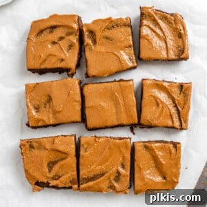 completed Sweet Potato Brownies cut into 9 squares on a white surface