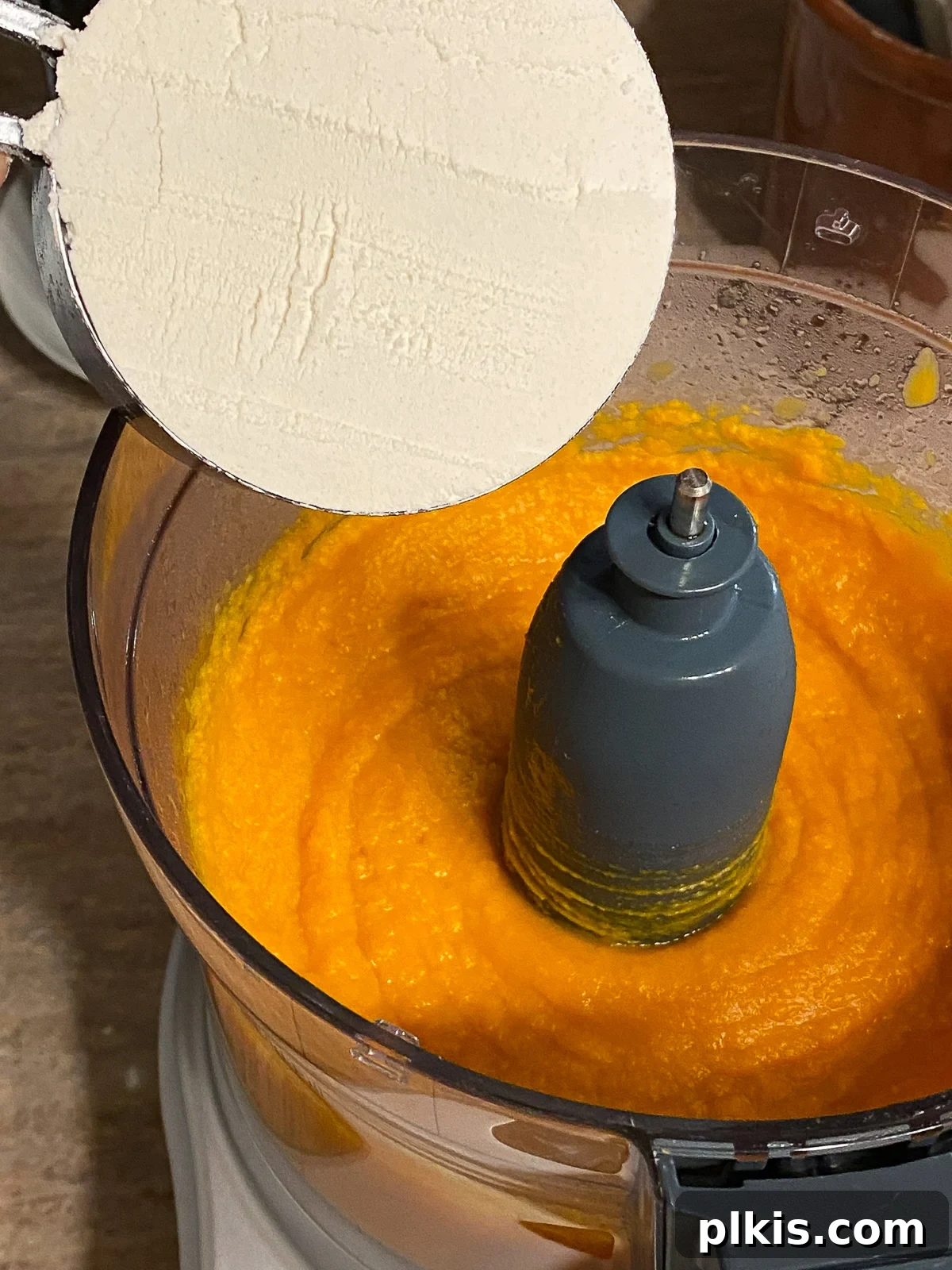 Decadent Vegan Sweet Potato Brownies 4 process of adding flour to sweet potato mixture in food processor