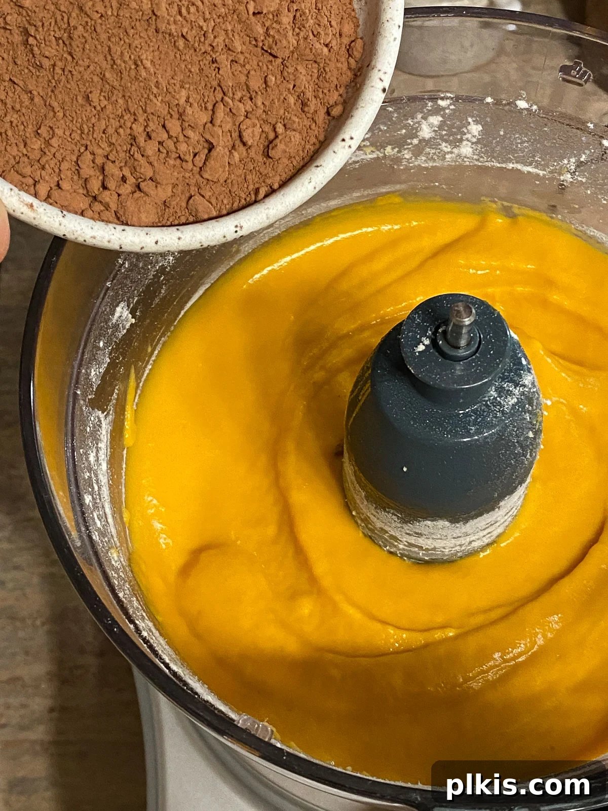 Decadent Vegan Sweet Potato Brownies 7 process of adding cocoa into Sweet Potato Brownies mixture in food processor