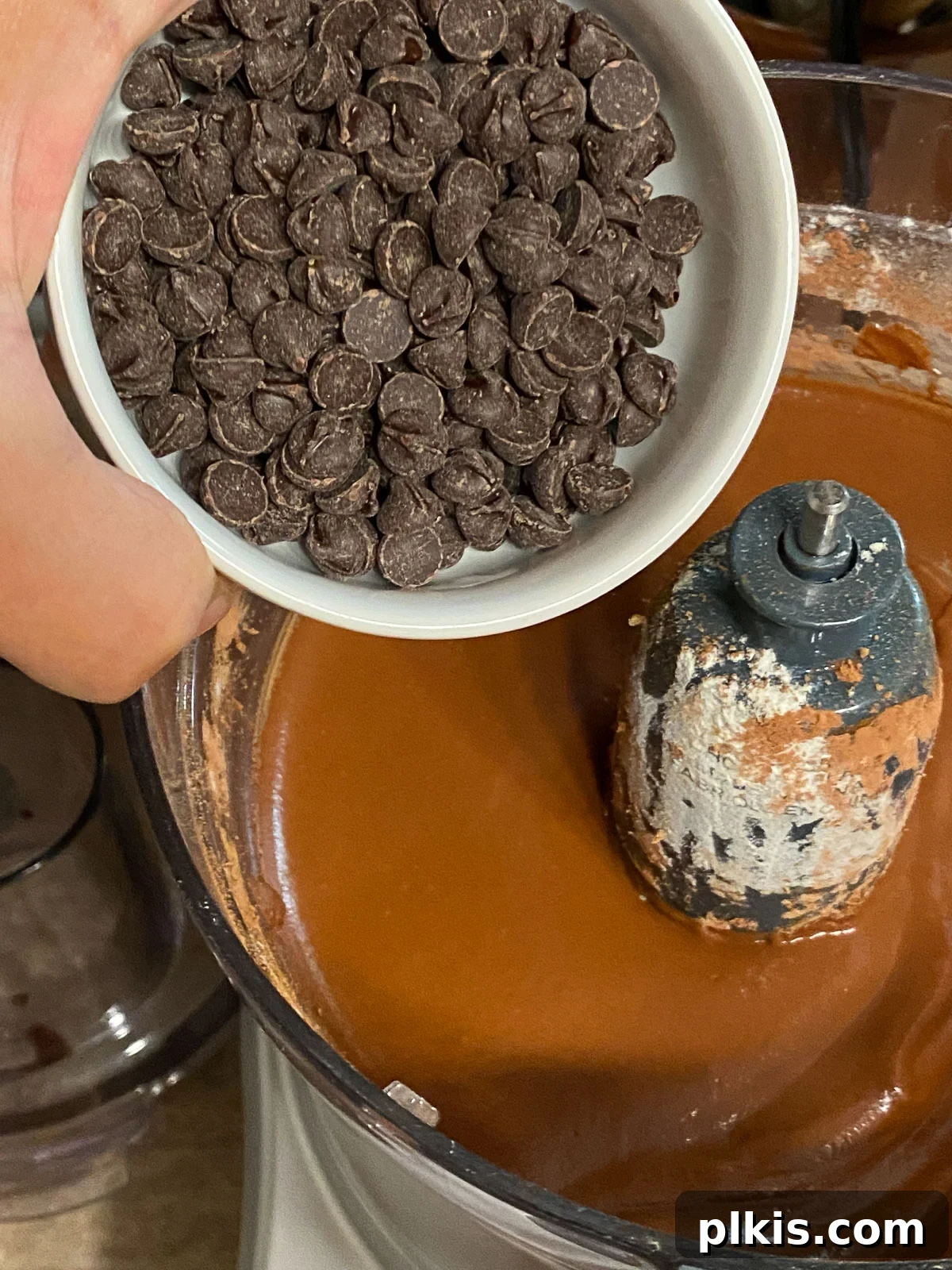 Decadent Vegan Sweet Potato Brownies 9 process of adding vegan chocolate chips into Sweet Potato Brownies mixture in blender