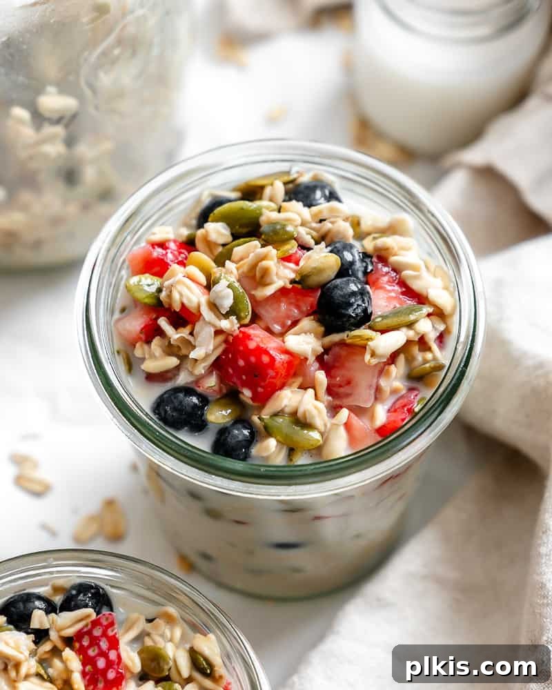 Vegan Overnight Oats: Endless Flavor Possibilities 2 Completed Vegan Overnight Oats in a glass jar, showcasing multiple topping variations