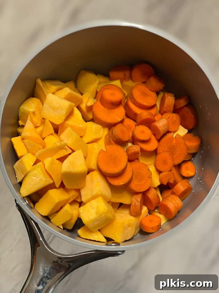 Golden Butternut Squash Sauce with Roasted Vegetables 4 process shot of adding veggies to pot