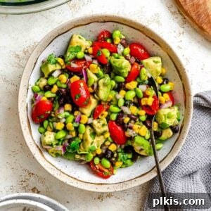 Vibrant Edamame Corn and Black Bean Salad 9 Completed Edamame Salad (With Corn and Black Beans) in a bowl, a vibrant and healthy vegan recipe.
