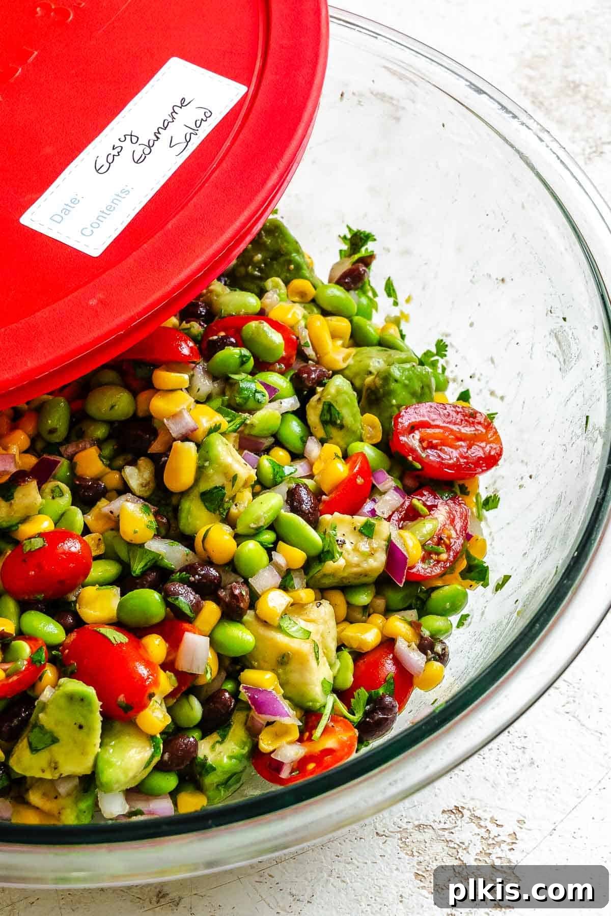 Vibrant Edamame Corn and Black Bean Salad 8 Completed Edamame Salad (With Corn and Black Beans) in a clear airtight storage bowl, ready for refrigeration.