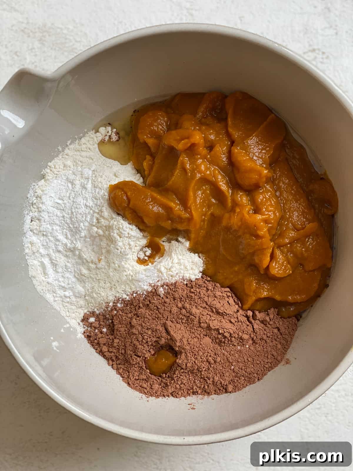 Pumpkin Spice Brownie Perfection 4 ingredients for Easy Pumpkin Brownies in a bowl, before mixing