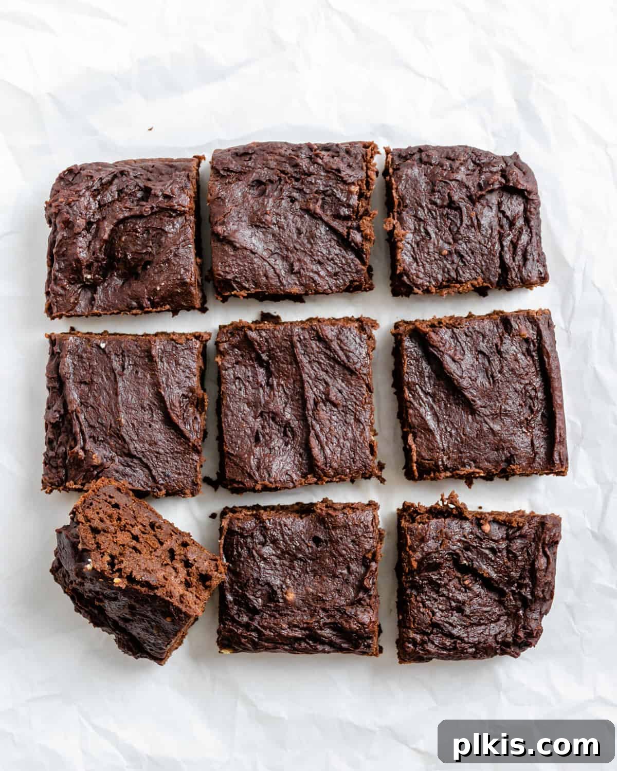 Pumpkin Spice Brownie Perfection 7 completed Easy Pumpkin Brownies against a white surface, cut into perfect squares