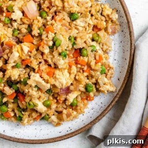 Quick Veggie Brown Rice Stir-Fry 9 completed Easy Vegetable Brown Fried Rice plated on a white plate against a light background