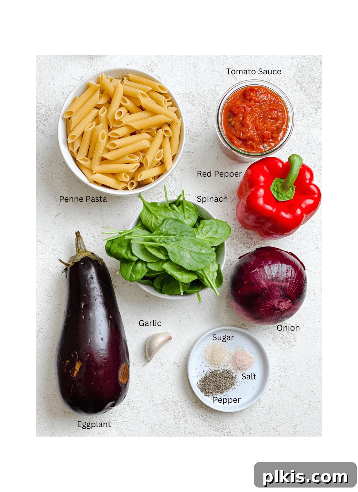 Effortless Eggplant Penne Alla Norma 3 Ingredients for Easy Penne Alla Norma (Eggplant Pasta) artfully arranged on a white surface.