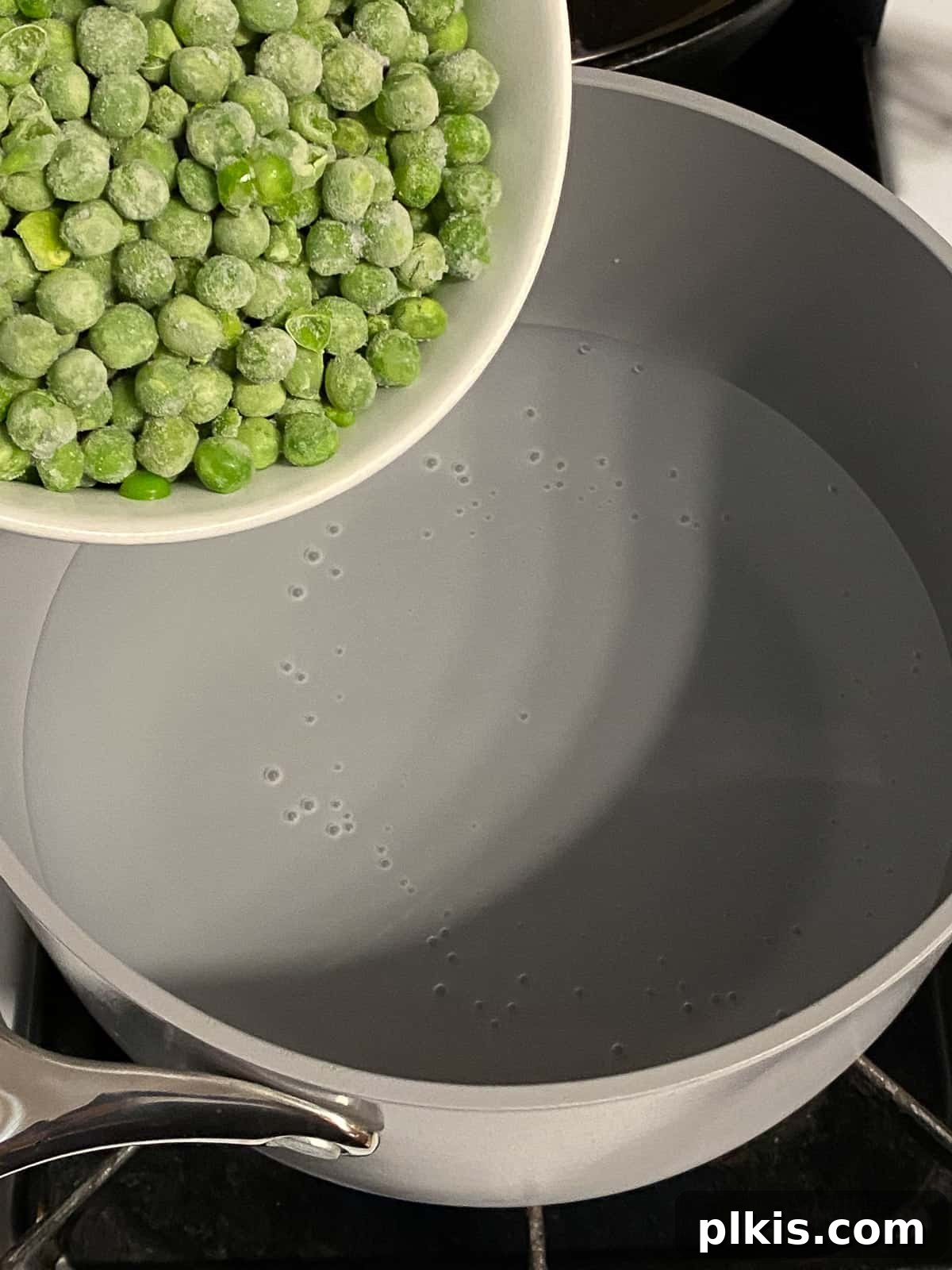 Effortless Creamy Peas with Golden Roasted Vegetables 4 process of adding peas to a pot of water