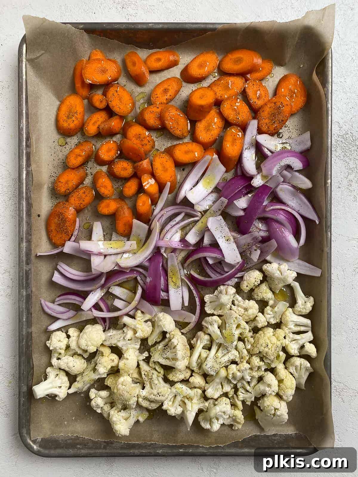 Effortless Creamy Peas with Golden Roasted Vegetables 6 sliced veggies on a baking tray