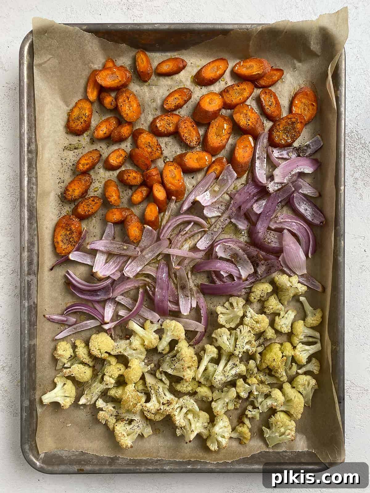 Effortless Creamy Peas with Golden Roasted Vegetables 9 post roasted sliced veggies on a baking tray