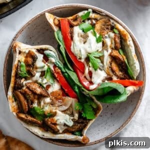 two open-faced mushroom sandwiches in a white bowl.