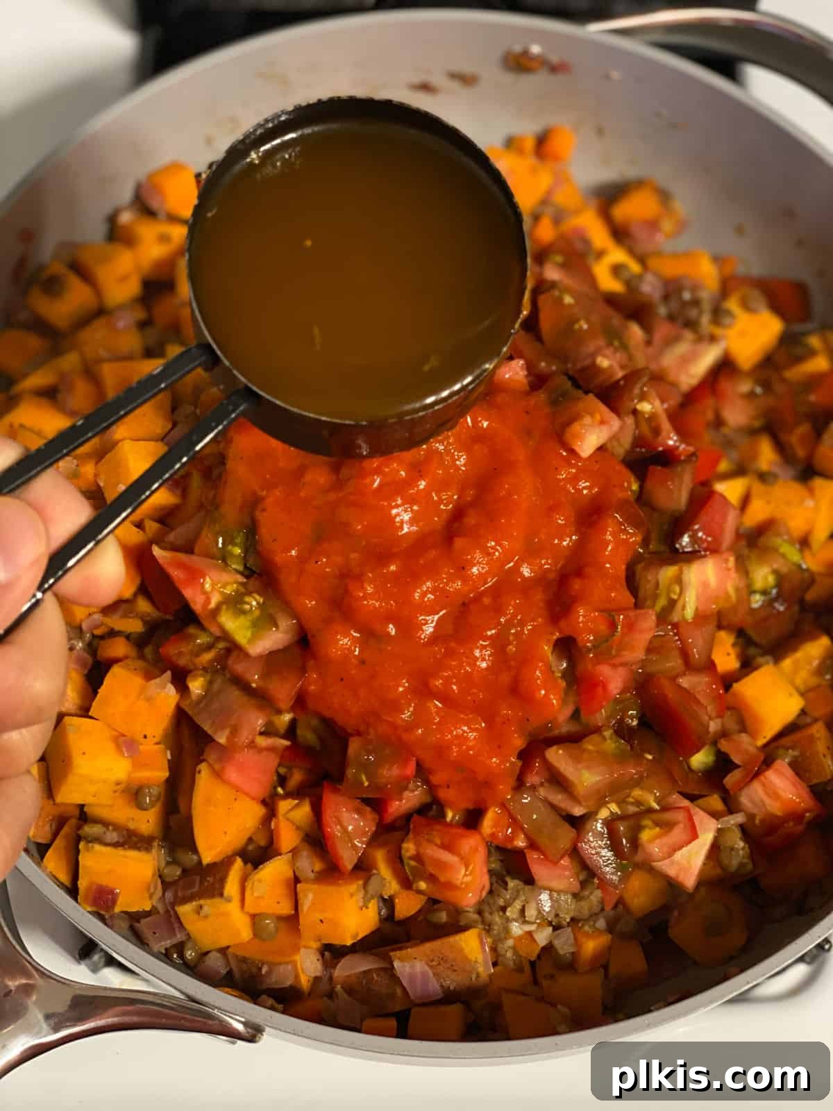 Deliciously Easy Vegan Sweet Potato Lasagna 13 process shot of adding water to pan