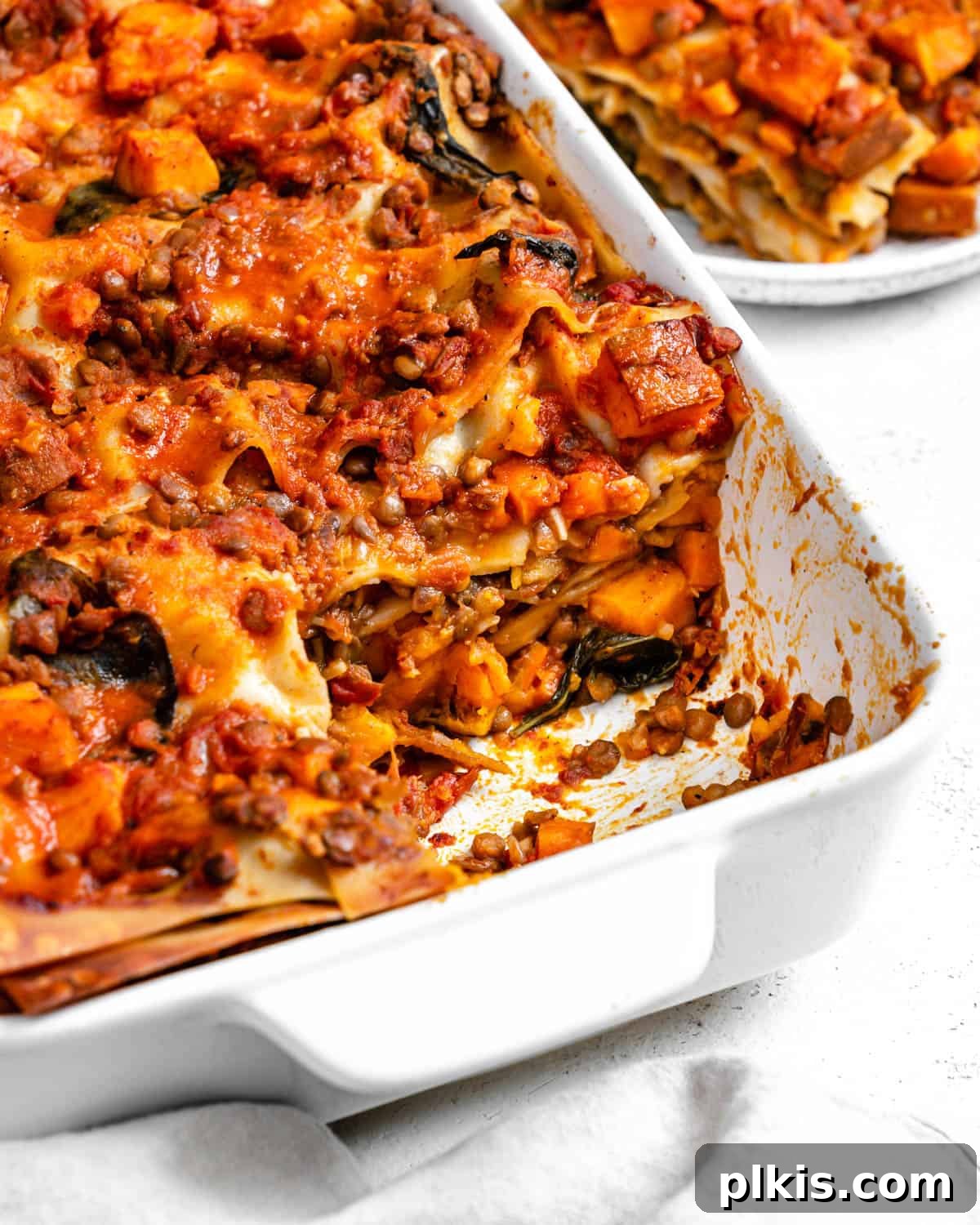 Deliciously Easy Vegan Sweet Potato Lasagna 18 completed Easy Sweet Potato Lasagna in a baking dish against a white surface
