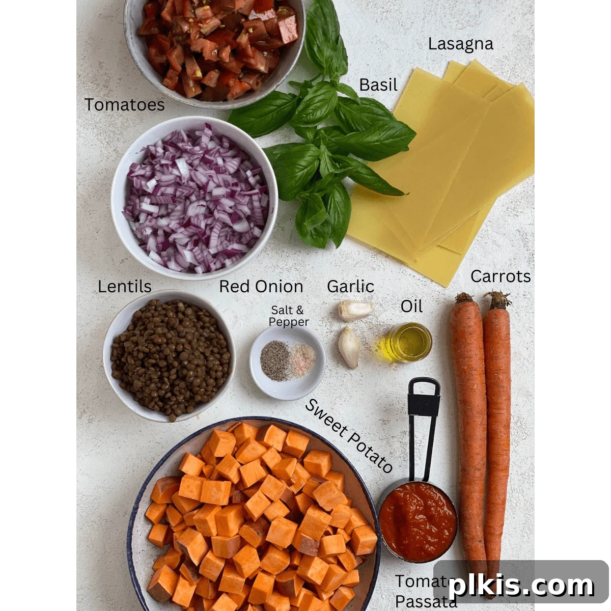 Deliciously Easy Vegan Sweet Potato Lasagna 3 Sweet Potato Lasagna ingredients measured out against a light surface