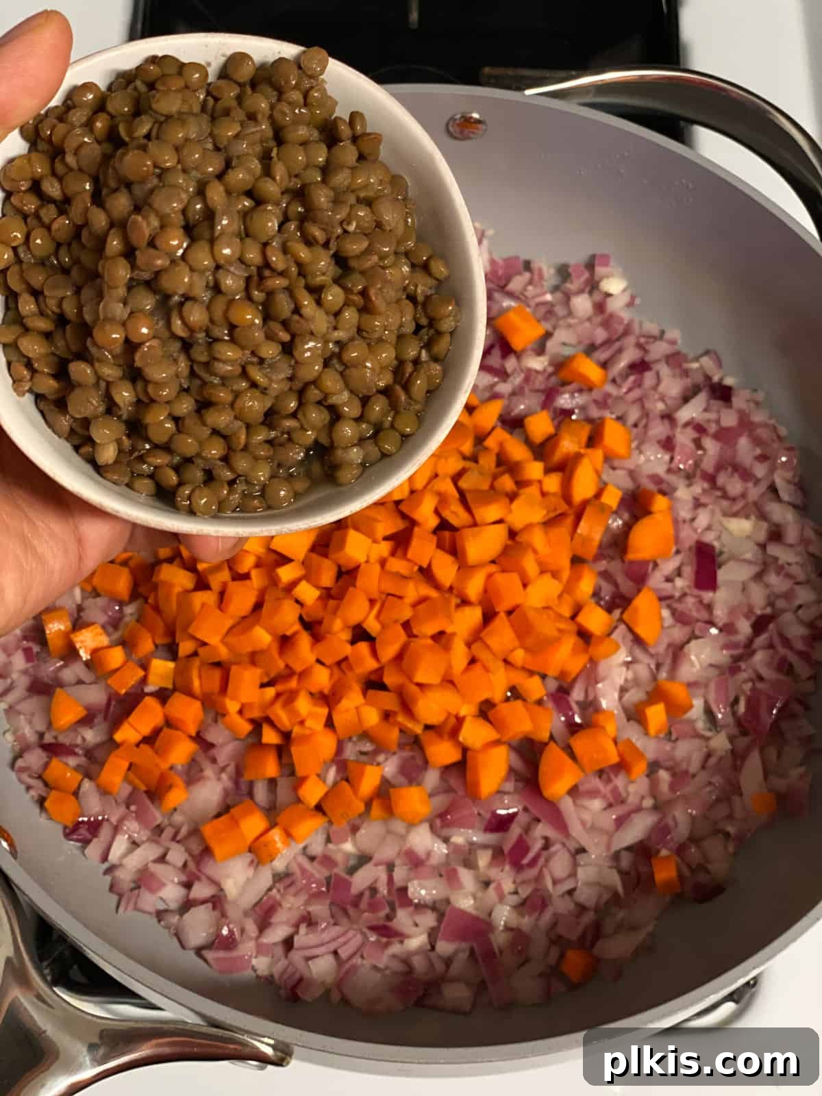 Deliciously Easy Vegan Sweet Potato Lasagna 7 process shot of adding lentils to pan